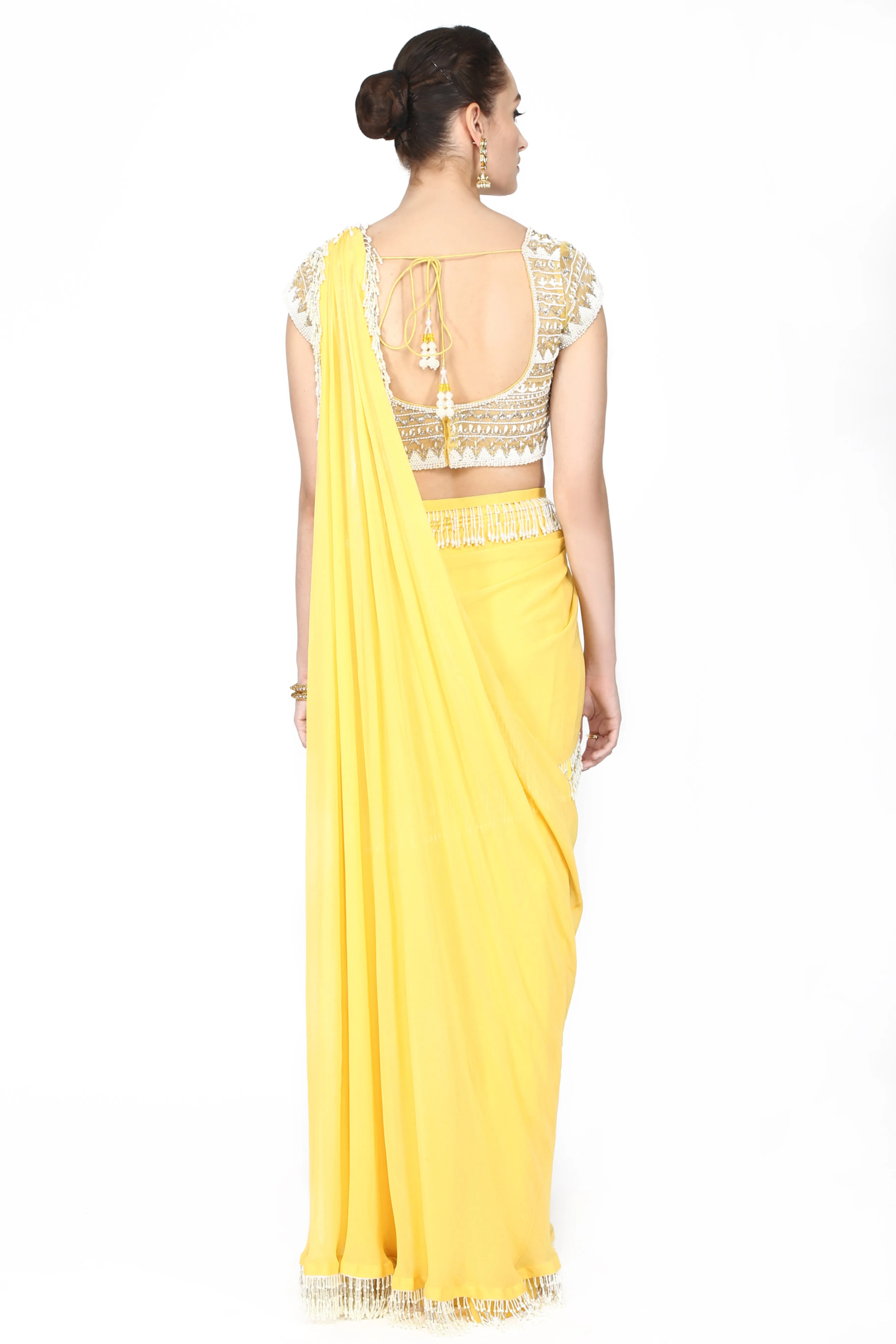 Lemon yellow drape saree.