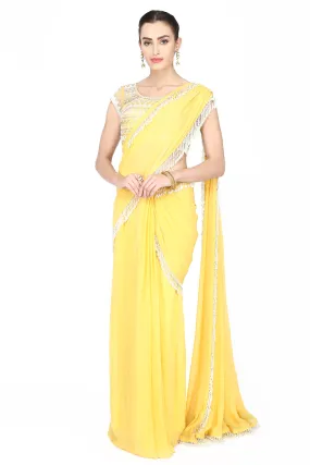 Lemon yellow drape saree.